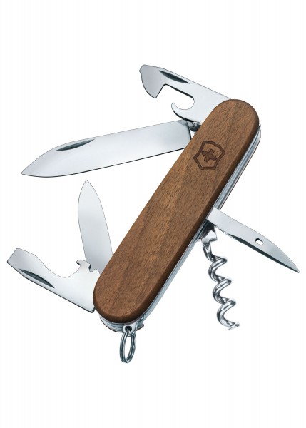 Abgebildet ist ein Taschenwerkzeug namens Spartan Wood. Es zeigt ein Multifunktionsmesser mit Holzgriff, das mehrere ausklappbare Werkzeuge enthält: großes Messer, kleines Messer, Korkenzieher und weitere Tools. Der Griff trägt das typische Emblem. D